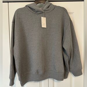 Gray, cropped hoodie new with tags.